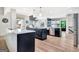 Modern kitchen featuring sleek cabinetry, stainless steel appliances, and a center island for ample counter space and functionality at 305 Postwood Dr, Fayetteville, GA 30215