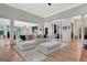 Expansive living room showcasing an open floor plan, comfortable seating, and views into the gourmet kitchen and dining area at 305 Postwood Dr, Fayetteville, GA 30215