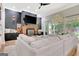 Spacious living room featuring a brick fireplace, large windows, and access to the outdoor area for seamless indoor-outdoor living at 305 Postwood Dr, Fayetteville, GA 30215