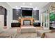 Cozy living room with a brick fireplace, built-in storage, and a comfortable seating area perfect for relaxation at 305 Postwood Dr, Fayetteville, GA 30215