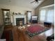 Inviting living room showcasing a fireplace, hardwood floors, and large windows for natural light at 650 Flippen Rd, Stockbridge, GA 30281