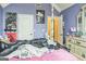 Bedroom with purple walls and decor at 115 Glen Echo Dr., Covington, GA 30016