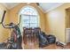 Cozy dining area with a large window and hardwood floors, offering a comfortable space for meals at 115 Glen Echo Dr., Covington, GA 30016