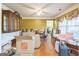 Bright dining room featuring hardwood floors and ample space, ideal for Gathering gatherings and entertaining at 115 Glen Echo Dr., Covington, GA 30016
