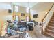 Large living room with high ceilings, natural light, and a fireplace, offering a comfortable and inviting space at 115 Glen Echo Dr., Covington, GA 30016