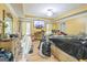 Spacious main bedroom with yellow walls, light-colored trim, wood flooring and a TV at 115 Glen Echo Dr., Covington, GA 30016