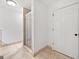 Bright bathroom featuring a tiled walk-in shower and a white six-panel door at 2010 Pearwood Path, Roswell, GA 30076