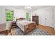 Charming bedroom with hardwood floors, a ceiling fan, and large windows for natural light at 2010 Pearwood Path, Roswell, GA 30076