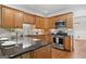 Updated kitchen featuring wood cabinets, stainless steel appliances, and subway tile backsplash at 2010 Pearwood Path, Roswell, GA 30076