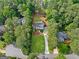 Expansive property with a pristine lawn, mature trees, and a long driveway leading to a beautiful home at 2885 Laurel Green Ct, Roswell, GA 30076