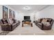 Inviting basement with stylish seating arrangement, a large television, and soft, neutral rug at 2885 Laurel Green Ct, Roswell, GA 30076