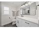 Bright bathroom with a modern vanity, sleek fixtures, and a well-lit mirror at 2885 Laurel Green Ct, Roswell, GA 30076
