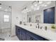Elegant bathroom with a double sink vanity, modern fixtures, and a large mirror at 2885 Laurel Green Ct, Roswell, GA 30076