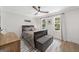 Comfortable bedroom with a wooden bed frame, soft lighting, and large windows at 2885 Laurel Green Ct, Roswell, GA 30076