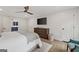 Cozy primary bedroom with hardwood floors, TV, and ample closet space at 2885 Laurel Green Ct, Roswell, GA 30076