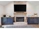 Cozy living room featuring a stone fireplace with built-in cabinets on either side at 2885 Laurel Green Ct, Roswell, GA 30076
