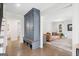 Hallway featuring hardwood floors, a built-in cabinet, and views to the living room and bathroom at 2885 Laurel Green Ct, Roswell, GA 30076