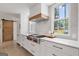 Kitchen with a gas range, white marble countertops, and stainless steel appliances at 2885 Laurel Green Ct, Roswell, GA 30076