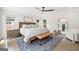 Inviting bedroom with natural light, rustic wood bed frame, and stylish decor at 2885 Laurel Green Ct, Roswell, GA 30076