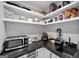Well-organized pantry with open shelving, small appliances, and a sink at 2885 Laurel Green Ct, Roswell, GA 30076