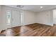 Basement with wood-look flooring, drop ceiling, and white trim at 1124 Ponderosa Park Dr, Forest Park, GA 30297
