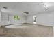 Large basement rec room with built-in shelves, neutral carpet and natural light at 1124 Ponderosa Park Dr, Forest Park, GA 30297
