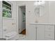 Finished basement bathroom with granite countertop, and tile floors at 1124 Ponderosa Park Dr, Forest Park, GA 30297