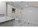 Finished basement bathroom with tile floors, tiled shower and granite countertop at 1124 Ponderosa Park Dr, Forest Park, GA 30297