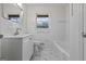 Bathroom with white tile, sink, and updated fixtures at 1124 Ponderosa Park Dr, Forest Park, GA 30297