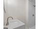 Bathroom with modern sink, countertop, and walk-in shower with white tile at 1124 Ponderosa Park Dr, Forest Park, GA 30297