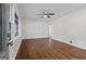 Bright bedroom with hardwood floors, ceiling fan and natural light streaming through the windows at 1124 Ponderosa Park Dr, Forest Park, GA 30297