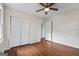 Bedroom with hardwood floors, closet, and natural light at 1124 Ponderosa Park Dr, Forest Park, GA 30297
