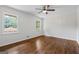 Bright, spacious bedroom with hardwood floors and natural light from multiple windows at 1124 Ponderosa Park Dr, Forest Park, GA 30297
