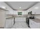 Charming kitchen with white cabinets, modern appliances, and granite countertops at 1124 Ponderosa Park Dr, Forest Park, GA 30297