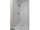 Walk-in shower with white subway tile, hexagon tile floor, and modern fixtures at 1124 Ponderosa Park Dr, Forest Park, GA 30297