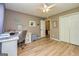 Cozy bedroom with white desk, ceiling fan, and spacious closet for ample storage at 130 Laurel Lake Rd, Tyrone, GA 30290