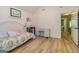 Bright bedroom featuring hard wood floors and a connected doorway at 130 Laurel Lake Rd, Tyrone, GA 30290