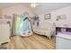 Charming bedroom with vaulted ceiling, whimsical decor and natural light at 130 Laurel Lake Rd, Tyrone, GA 30290