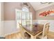 Inviting dining room with natural light and a wood table at 130 Laurel Lake Rd, Tyrone, GA 30290