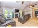 Inviting living room features a fireplace, vaulted ceiling, and comfortable seating at 130 Laurel Lake Rd, Tyrone, GA 30290