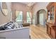 Bright living room boasts a high ceiling, large windows, and beautiful furnishings at 130 Laurel Lake Rd, Tyrone, GA 30290