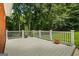 Enjoy the outdoors on this back deck surrounded by lush trees and greenery at 40 Costleys Bridge Dr, Oxford, GA 30054