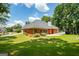 Back exterior with a spacious yard and a white deck, perfect for outdoor living and entertaining at 40 Costleys Bridge Dr, Oxford, GA 30054