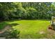 Lush backyard featuring a well-maintained lawn and mature trees, offering a private and serene outdoor setting at 40 Costleys Bridge Dr, Oxford, GA 30054