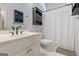 Neutral bathroom with a white vanity, tile flooring, and shower with white curtain at 40 Costleys Bridge Dr, Oxford, GA 30054