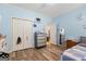bedroom features wood floors, closet, and blue walls at 40 Costleys Bridge Dr, Oxford, GA 30054