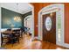 Elegant entryway showcasing a chandelier, hardwood floors, and decorative wallpaper at 40 Costleys Bridge Dr, Oxford, GA 30054