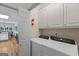 Convenient laundry area featuring modern appliances, ample storage, and easy access to the kitchen, simplifying household chores at 40 Costleys Bridge Dr, Oxford, GA 30054