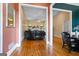 Inviting living room featuring hardwood floors, fireplace, and a comfortable leather sofa at 40 Costleys Bridge Dr, Oxford, GA 30054