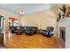 Comfortable living room showcasing hardwood floors, fireplace, and a leather sectional perfect for relaxing and entertaining at 40 Costleys Bridge Dr, Oxford, GA 30054